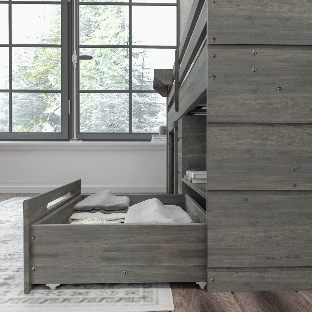Max and Lily Solid Wood Play and Store Low Loft in Driftwood - close-up of the roll-out under-bed storage drawer filled with folded blankets beside a sunny window.