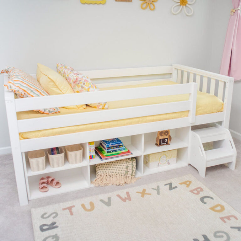 Max And Lily Soren Twin Ultra Low Loft Bed With Bookcase White Under Bed Storage Max and Lily Soren Twin Ultra Low Loft Bed With Bookcase in white - styled bedroom scene with the under-bed bookcase filled with books, baskets and toys.