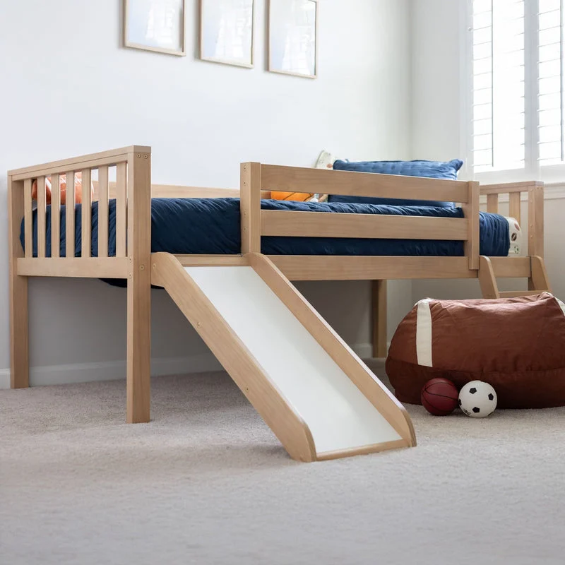 Max And Lily Soren Twin Ultra Low Loft Bed With Slide Blonde Room Scene 1 Max and Lily Soren Twin Ultra Low Loft Bed With Slide in Blonde - angled view in a kids' bedroom showing the attached wooden slide, safety guardrail and navy sports-themed bedding