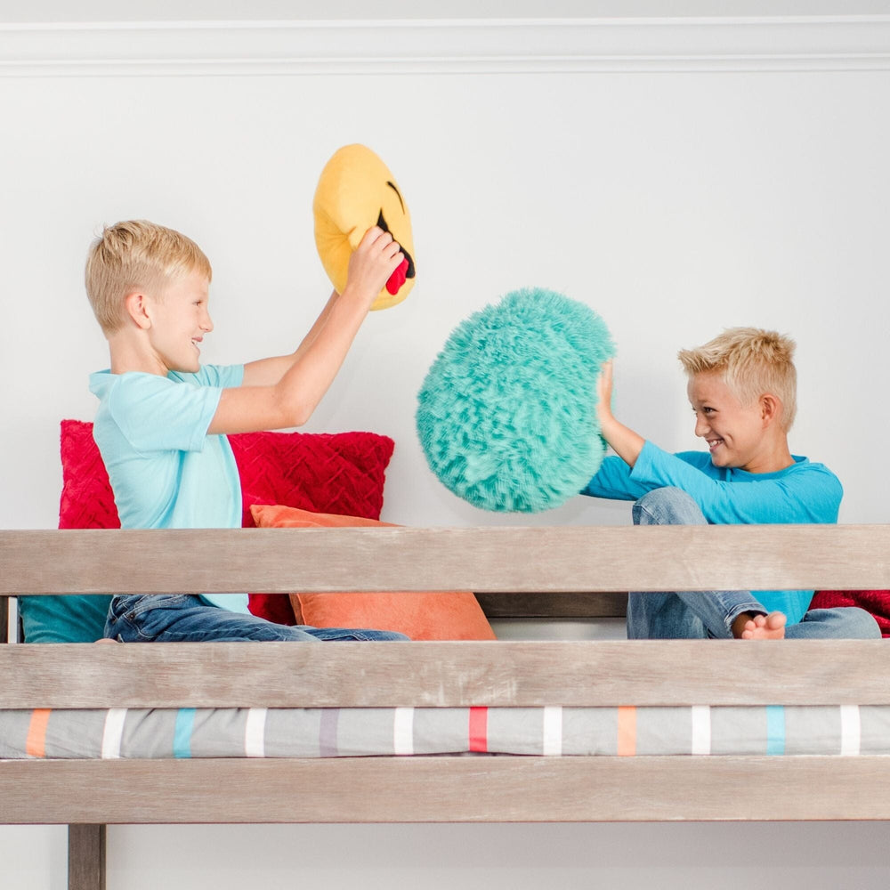 Max And Lily Twin High Loft Bed Clay Kids Playing Max and Lily Twin High Loft Bed in Clay - two children playfully pillow-fighting on the raised top bunk behind the wooden safety guardrail.