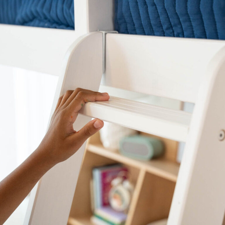 Max And Lily Twin High Loft Bed White Ladder Detail 7 Max and Lily Twin High Loft Bed in White - close-up of a child's hand gripping a grooved, non-slip ladder step.