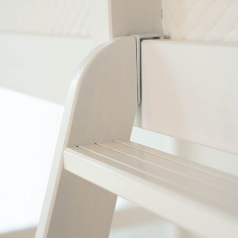 Max And Lily Twin High Loft Bed White Ladder Detail 9 Max and Lily Twin High Loft Bed in White - close-up of the ladder's top hook attachment and grooved step.