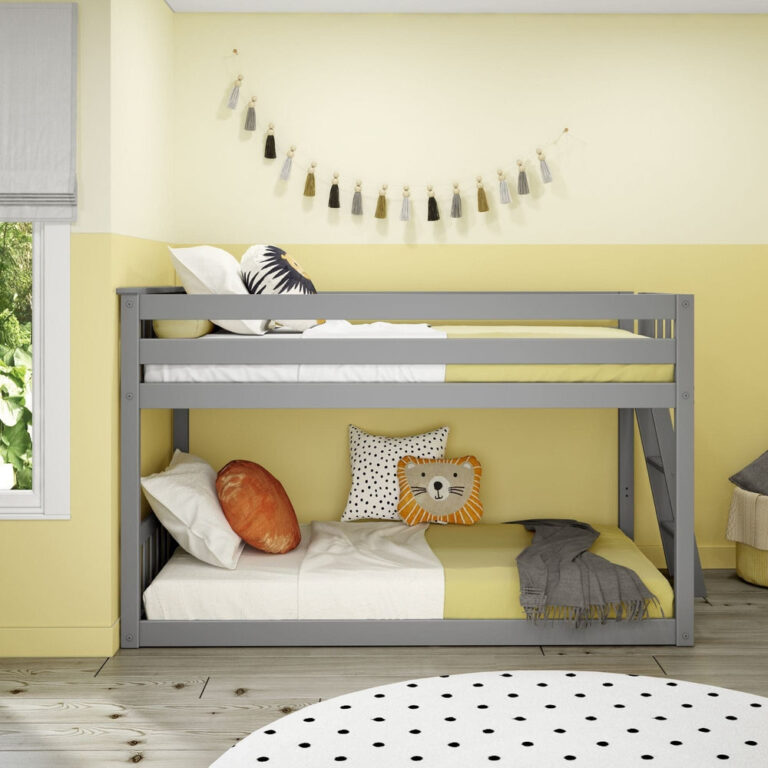Max And Lily Twin Low Bunk Bed With Ladder On End Grey Front View Max And Lily Twin Low Bunk Bed with Ladder on End in Grey - front view of the low bunk in a decorated bedroom showing the upper guardrail and made lower bunk.