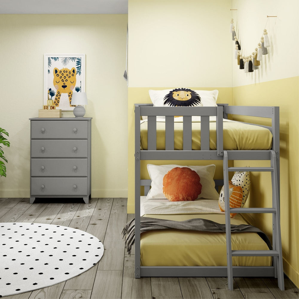 Max And Lily Twin Low Bunk Bed With Ladder On End Grey Room Scene 6 Max And Lily Twin Low Bunk Bed with Ladder on End in Grey - the low bunk styled in a bedroom beside a matching grey dresser with wall art and decor.