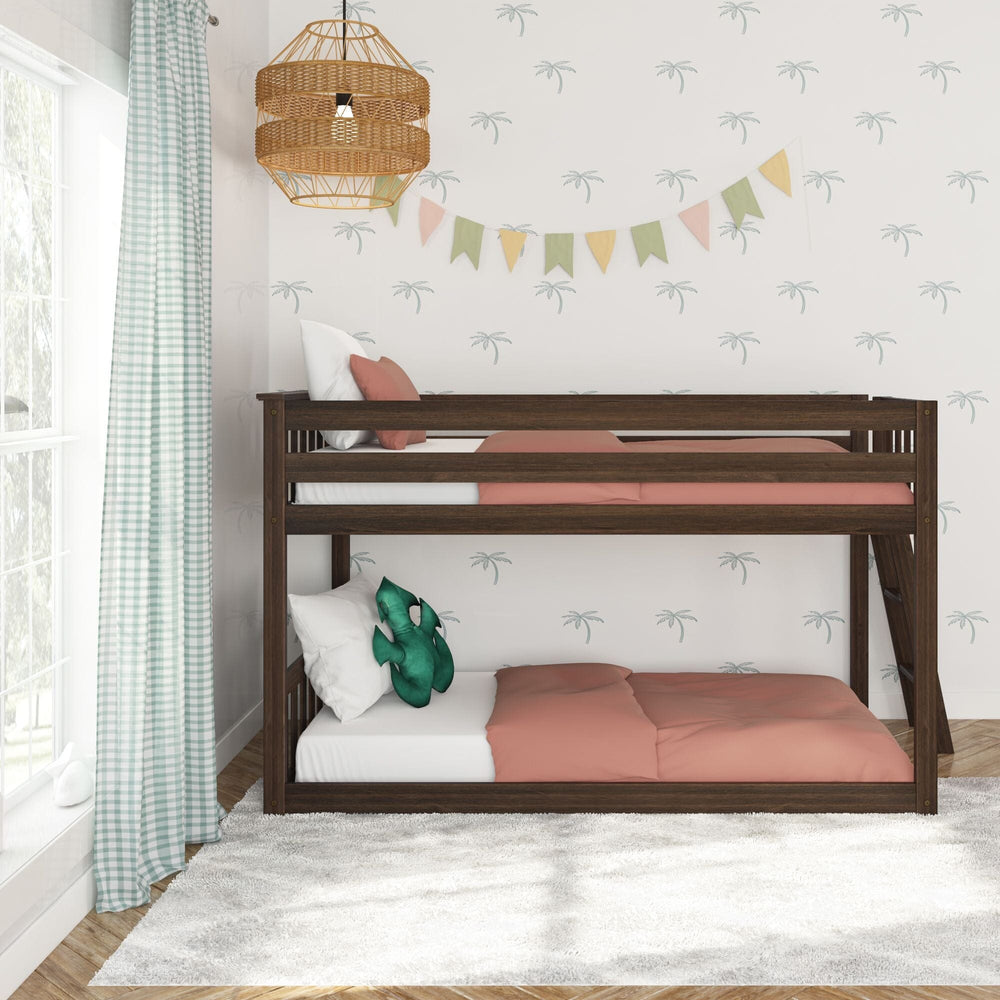 Max And Lily Twin Low Bunk Bed With Ladder On End Walnut Front View Max And Lily Twin Low Bunk Bed with Ladder on End in Walnut - front view in a bright bedroom showing the low-height frame and full-length guardrail.