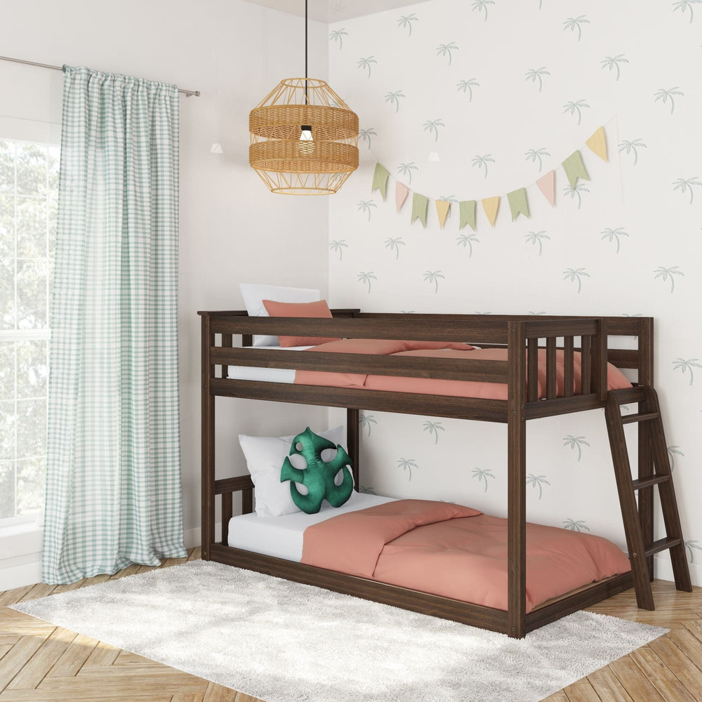 Max And Lily Twin Low Bunk Bed With Ladder On End Walnut Room Scene 1 Max And Lily Twin Low Bunk Bed with Ladder on End in Walnut - styled in a kids' bedroom with palm-tree wallpaper and gingham curtains, showing the ladder mounted on the end.