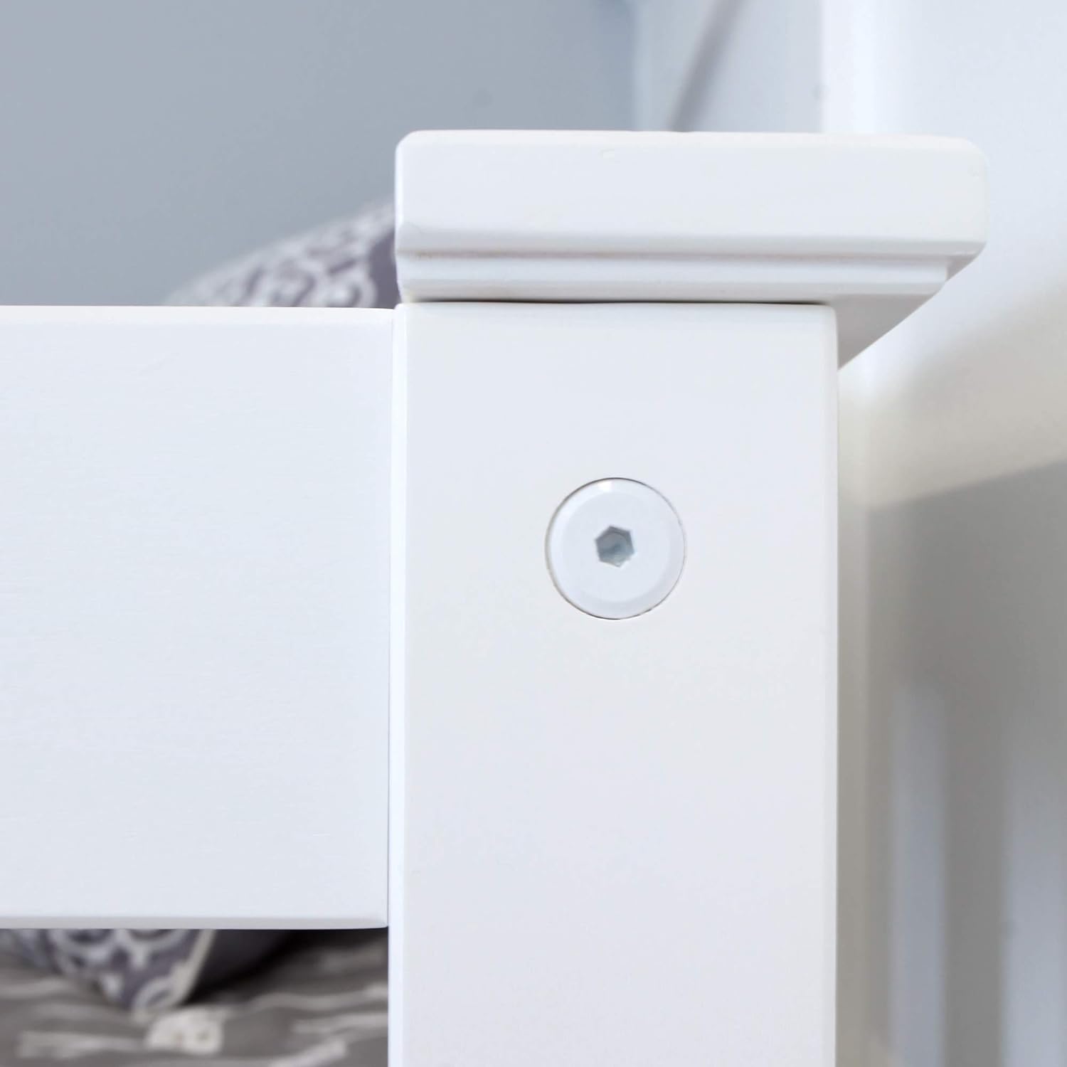 Max and Lily Twin Low Loft Bed - close-up of a countersunk, color-matched screw on the white bed post.