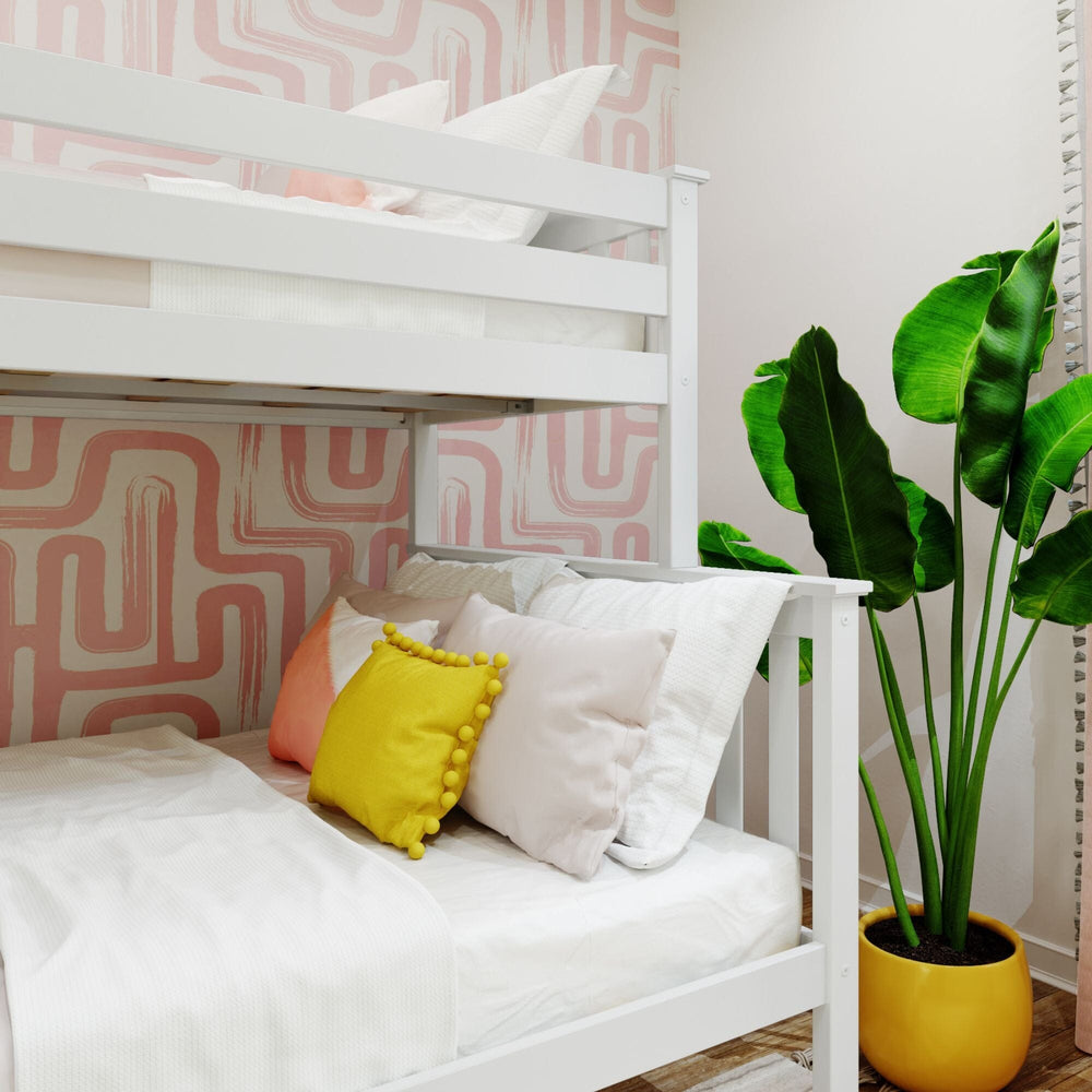 Max and Lily Twin Over Full Bunk Bed With Ladder On End in White - close-up of the lower full bed dressed with decorative pillows beneath the upper bunk.