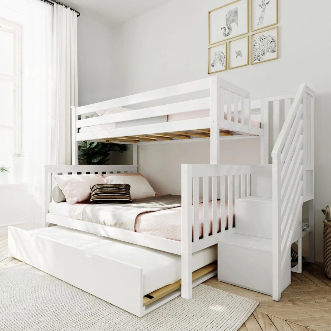 Max and Lily Twin Over Full Bunk Bed with Stairs and Trundle in White - angled view in a bright bedroom with the trundle pulled out, storage staircase on the right and safety guardrails on the top bunk