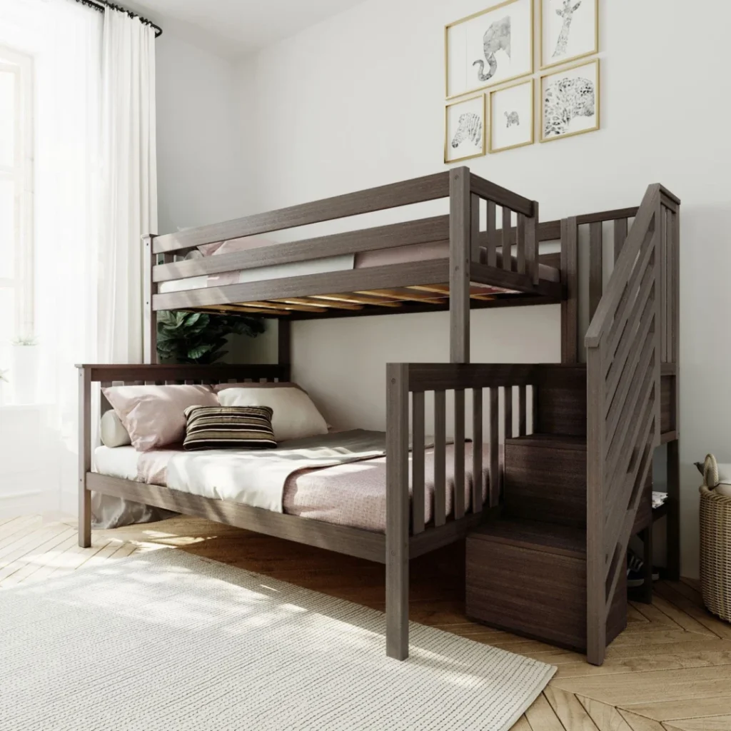 Max and Lily Twin Over Full Bunk Bed with Stairs in Clay - staged in a sunlit kids bedroom with safety guardrails on the top bunk, storage staircase at the end, and pink bedding on both beds