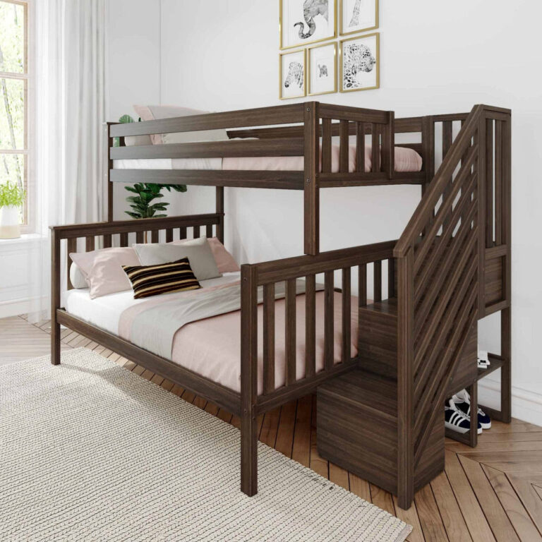 Max and Lily Twin Over Full Bunk Bed with Stairs in Walnut - angled view in a styled bedroom showing the twin top bunk with safety guardrails, full lower bed with pink bedding, and staircase with built-in storage steps