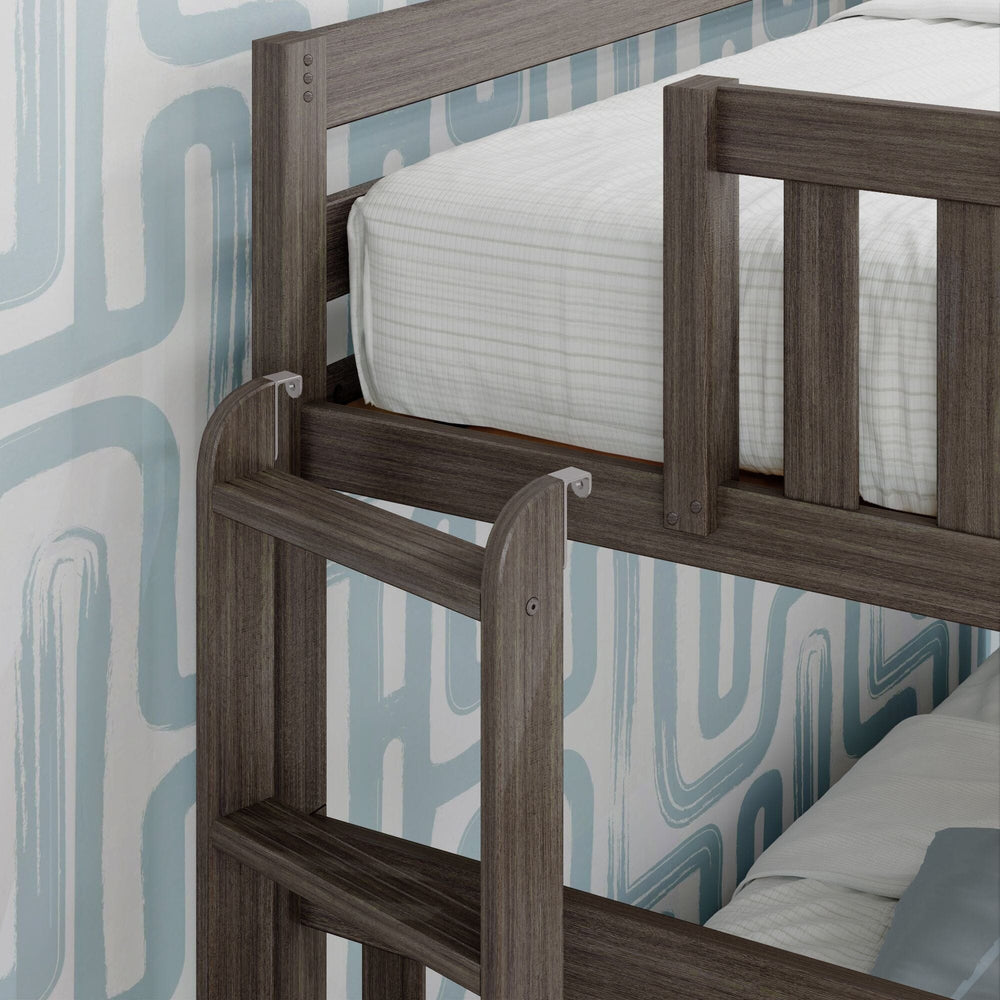 Max and Lily Twin Over Full Bunk Bed With Trundle and Ladder on End in clay - close-up of the upper bunk safety guardrail and the end-mounted ladder hooks.