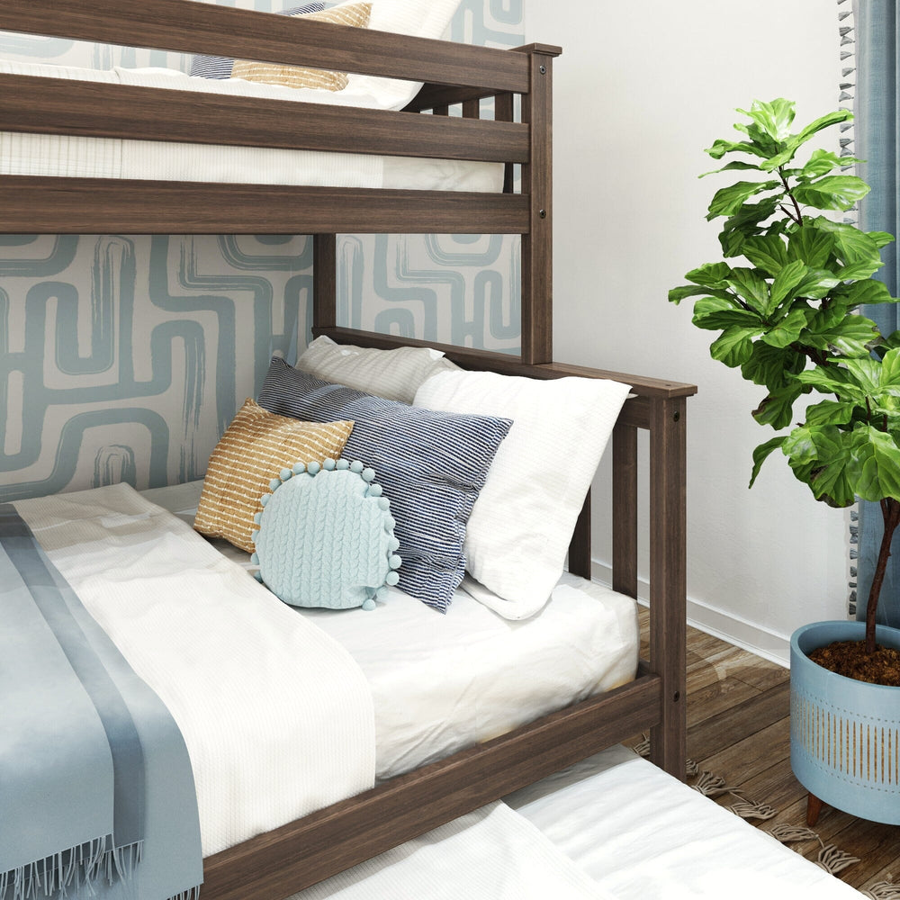 Max and Lily Twin Over Full Bunk Bed With Trundle and Ladder on End in Walnut - close view of the lower full bunk styled with decorative pillows against the end guardrail post.