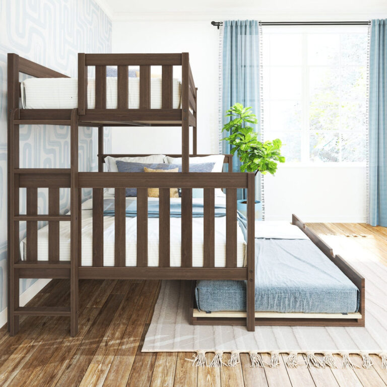 Max and Lily Twin Over Full Bunk Bed With Trundle and Ladder on End in Walnut - side view in a bright bedroom with the trundle bed extended on the floor and windows behind.