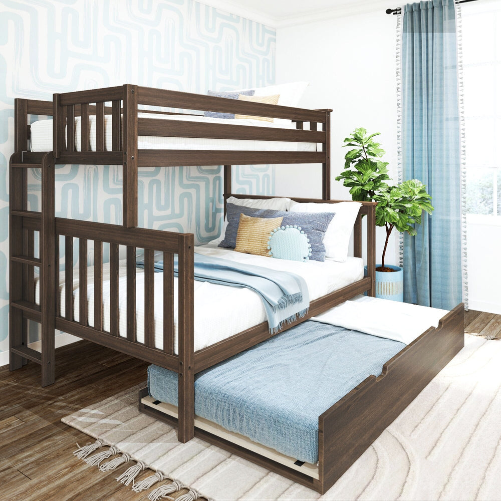 Max and Lily Twin Over Full Bunk Bed With Trundle and Ladder on End in Walnut - angled view in a styled bedroom with the trundle bed pulled out and made up with blue bedding.