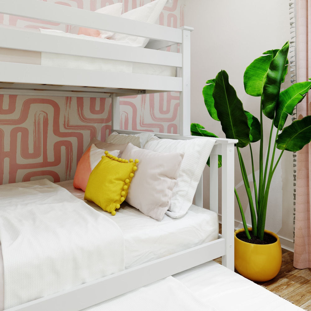 Max and Lily Twin Over Full Bunk Bed With Trundle and Ladder on End in White - close-up of the lower full bunk styled with decorative pillows beside a potted plant