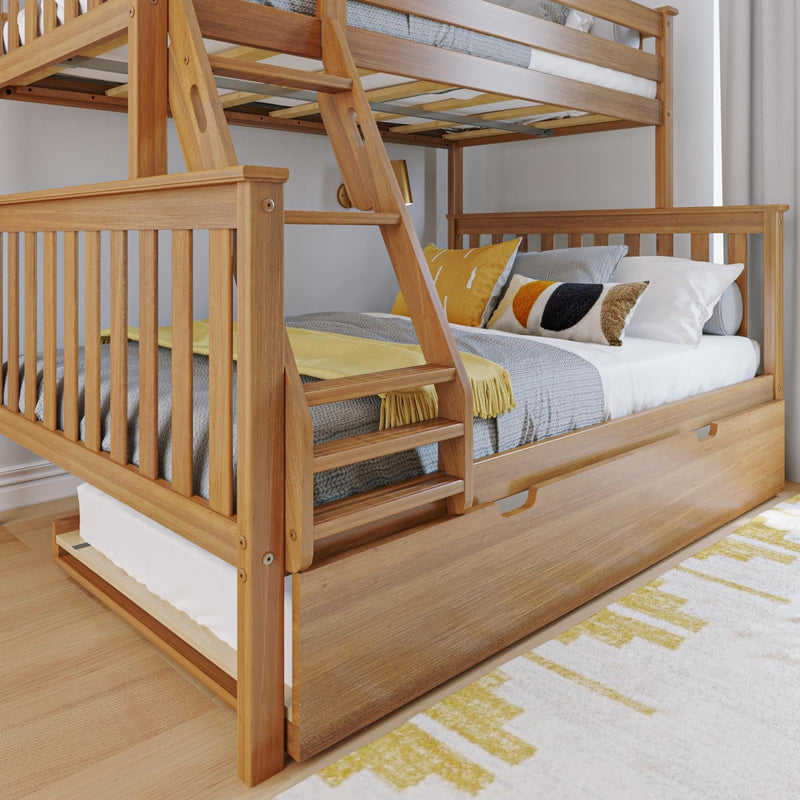Max and Lily Twin Over Full Bunk Bed with Trundle in Pecan - closeup of the lower full bed with slatted footboard, angled ladder steps and closed trundle drawer in a styled bedroom