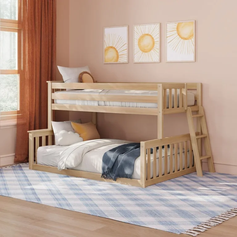 Max and Lily Twin Over Full Low Bunk Bed in Blonde - styled kids' bedroom scene with the bunk bed against pink walls, an angled ladder on the right, and framed sun wall art.