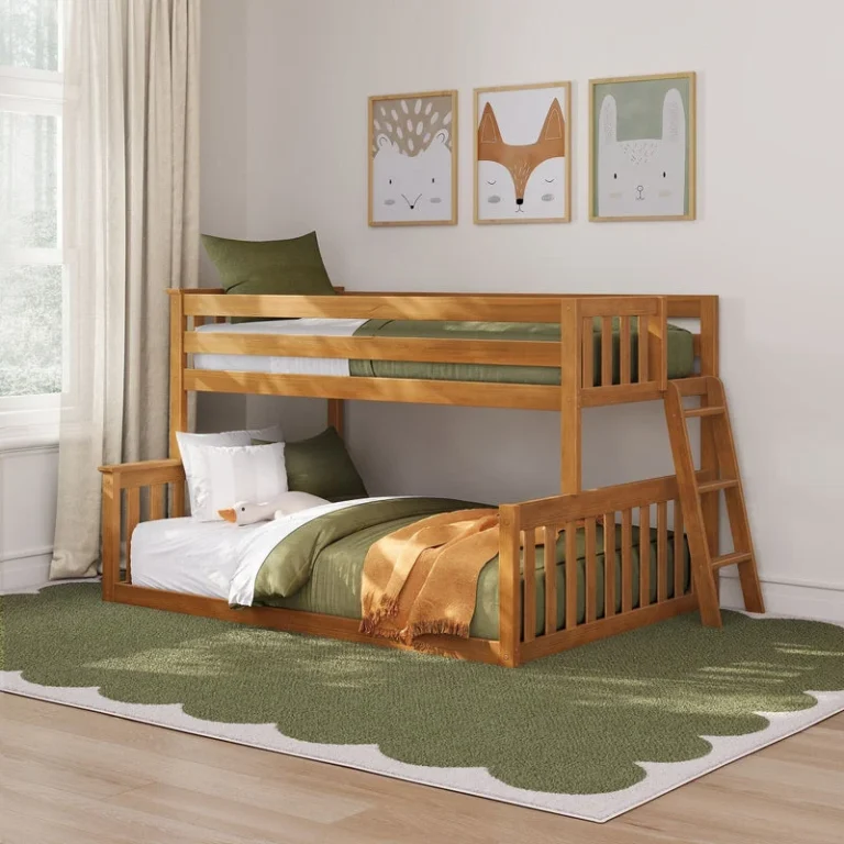 Max and Lily Twin Over Full Low Bunk Bed in Pecan - staged in a bedroom with green bedding, an orange throw, a curtained window, and the ladder on the right