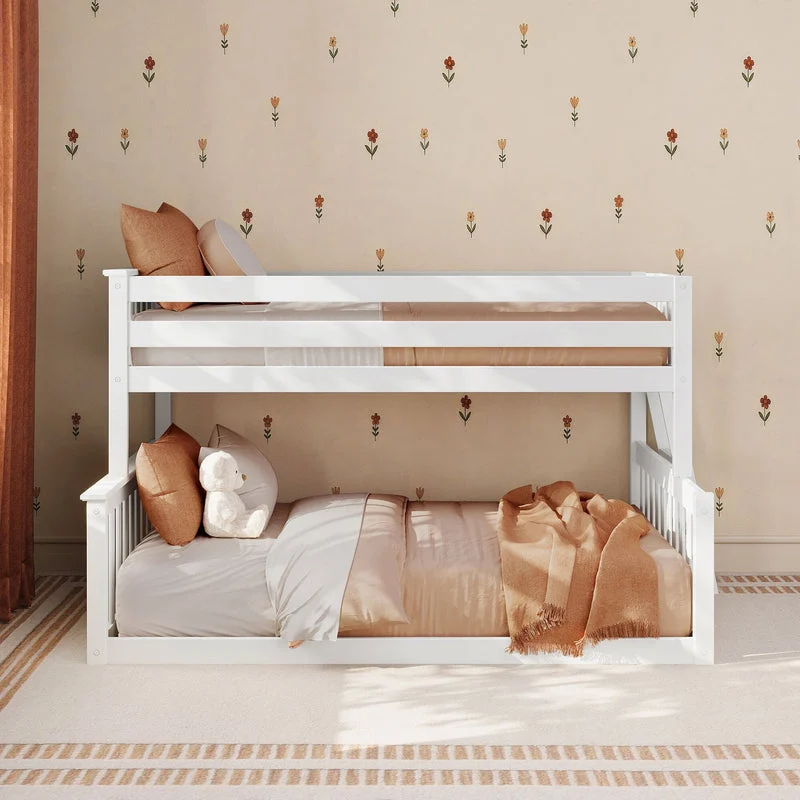 Max and Lily Twin Over Full Low Bunk Bed in White - front room scene styled with pillows, a teddy bear, and bedding against a floral wallpaper backdrop.