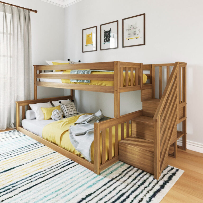 Max And Lily Twin Over Full Low Bunk Bed With Stairs Pecan Room Scene 1 Max and Lily Twin Over Full Low Bunk Bed With Stairs in Pecan - angled room view showing the twin-over-full low bunk with a side staircase, yellow bedding, and framed cat prints on the wall.
