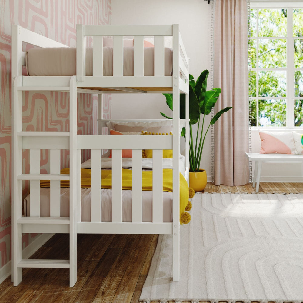 Max and Lily Twin Over Twin Bunk Bed with Ladder on End in White - angled room scene from the ladder end with both bunks made up, a bright window and pink curtains
