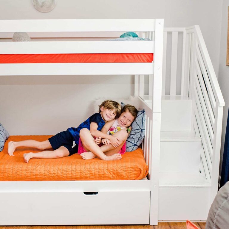 Max And Lily Twin Over Twin Bunk Bed With Stairs And Trundle Kids Playing 4 Max and Lily Twin Over Twin Bunk Bed with Stairs and Trundle - two children relaxing together on the lower bunk beside the staircase