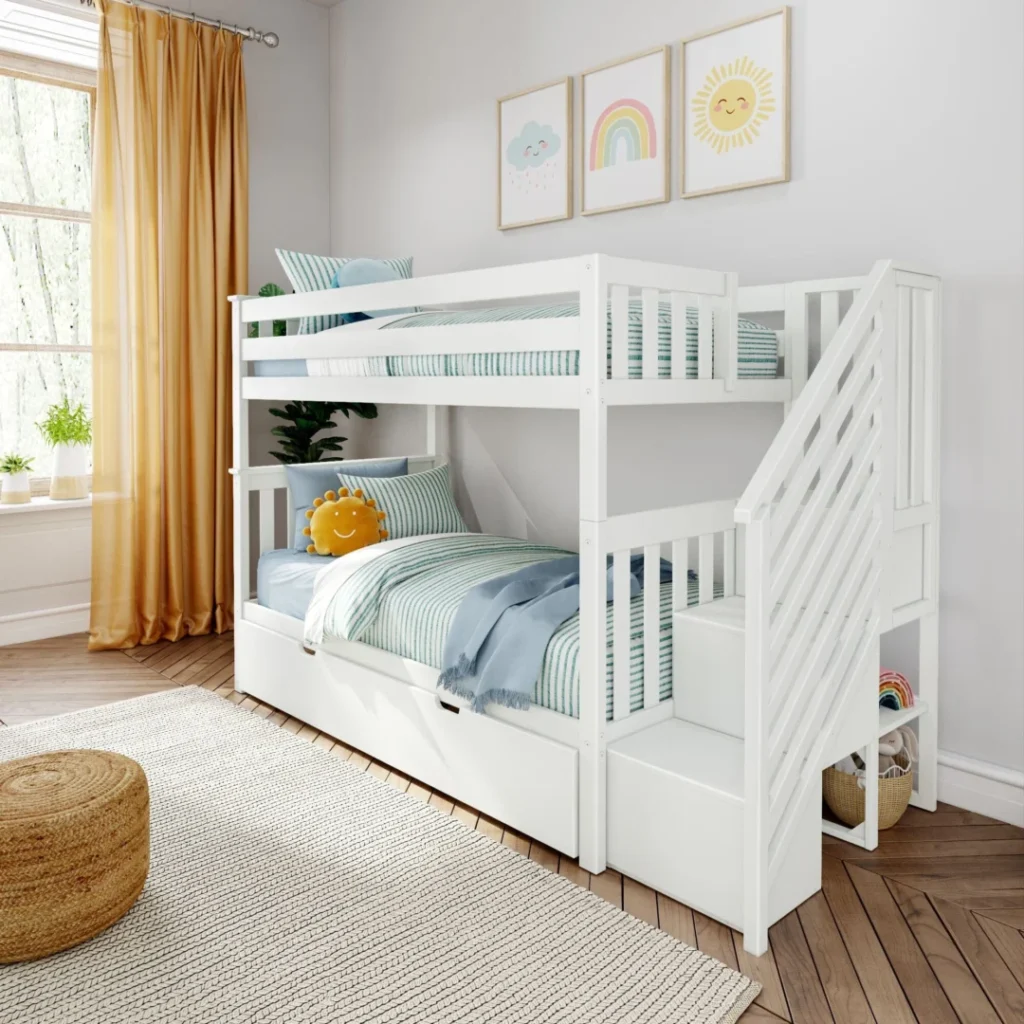 Max and Lily Twin Over Twin Bunk Bed with Stairs and Trundle in White - angled view in a kids bedroom showing safety guardrails, staircase on the end and closed trundle under the bottom bunk