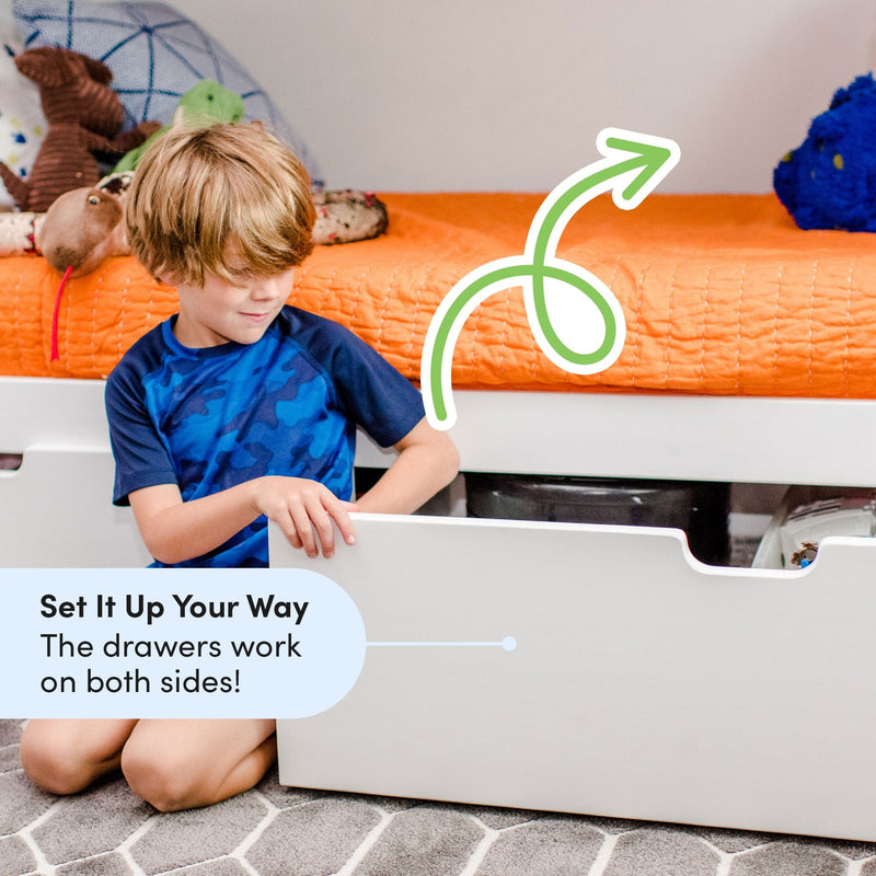 Max And Lily Twin Over Twin Bunk Bed With Stairs Storage Drawers White Reversible Drawers Max and Lily Twin Over Twin Bunk Bed With Stairs & Storage Drawers in white - a boy opening the reversible storage drawer, which can be installed on either side.