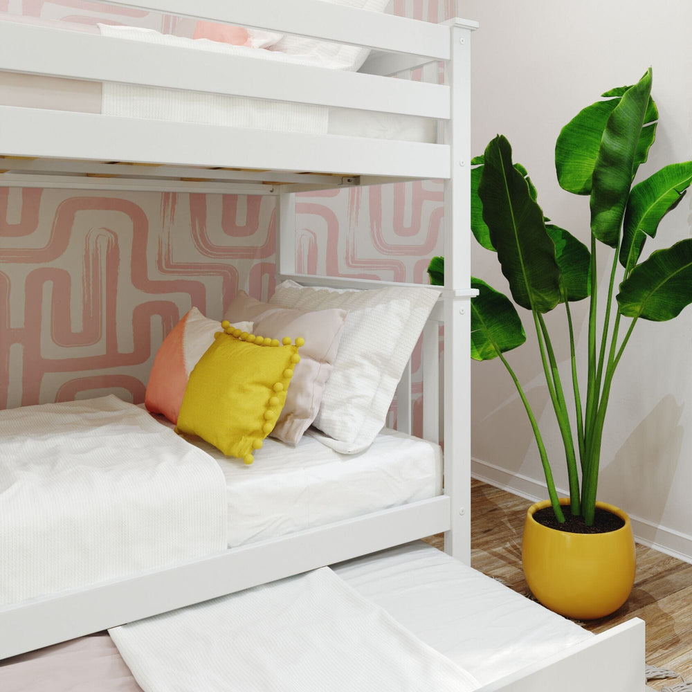 Max and Lily Twin Over Twin Bunk Bed With Trundle Bed and Ladder on End in white - close-up of the lower bunk with pillows and the trundle sheet pulled out.