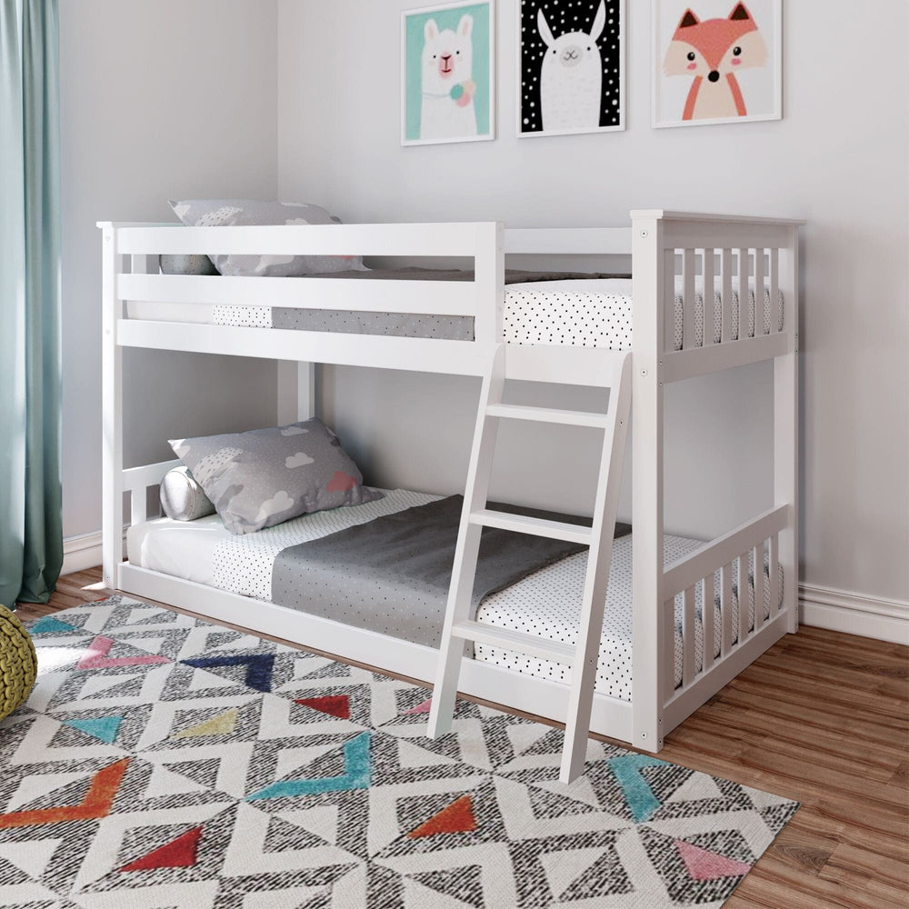 Max And Lily Twin over Twin Low Bunk Bed in White - low bunk bed with safety guardrails and angled ladder styled in a kids room with a colourful rug and wall art