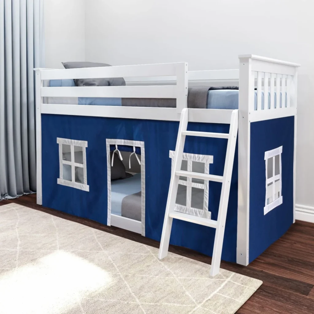 Max and Lily Twin Over Twin Low Bunk Bed With Curtain in Blue/White - low bunk bed in a kids bedroom with blue playhouse curtain featuring window and door panels, angled ladder, and top guardrails