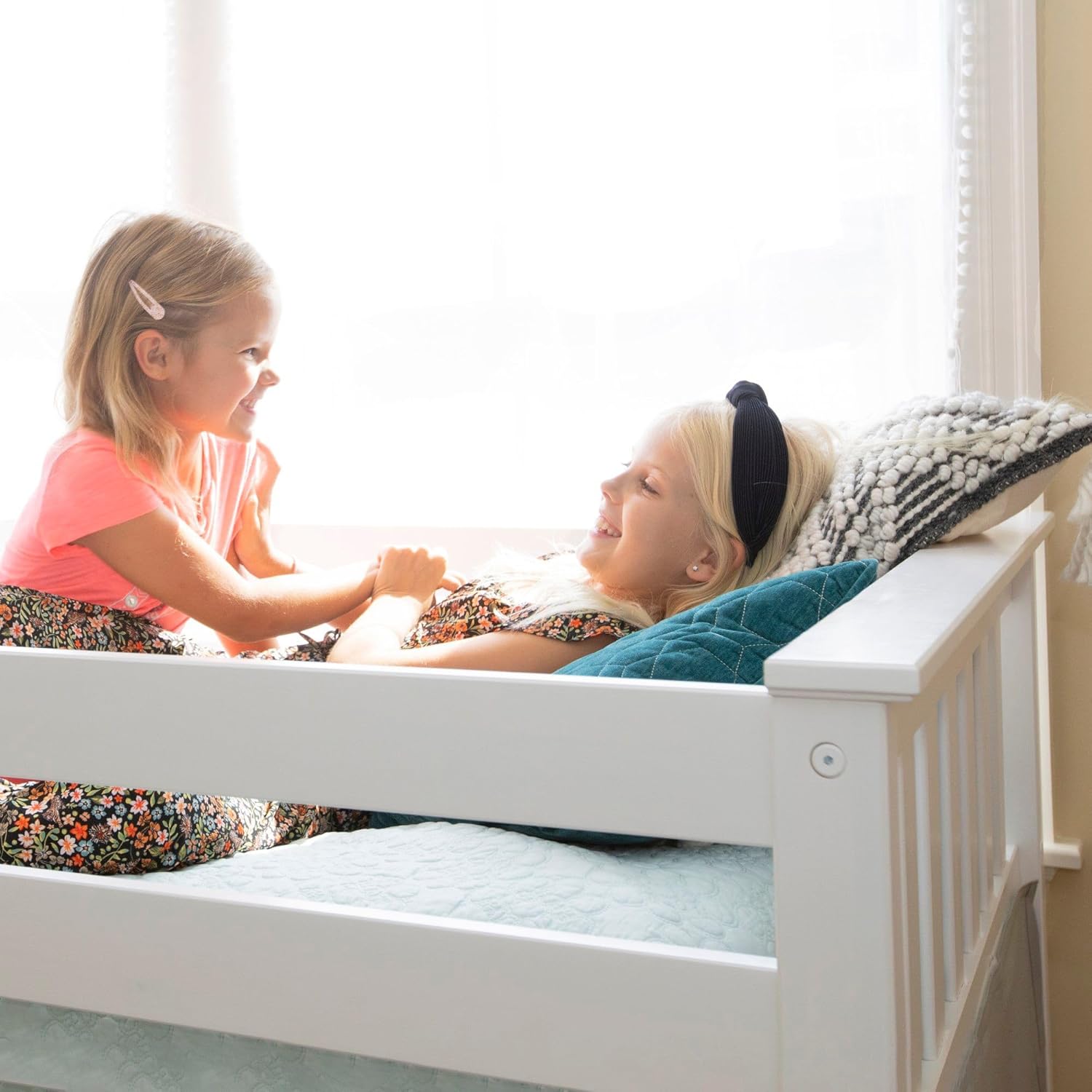 Max And Lily Twin Over Twin Low Bunk Bed With Curtain Kids Playing 2 Max and Lily Twin Over Twin Low Bunk Bed With Curtain - two young girls playing together on the top bunk beside a bright window