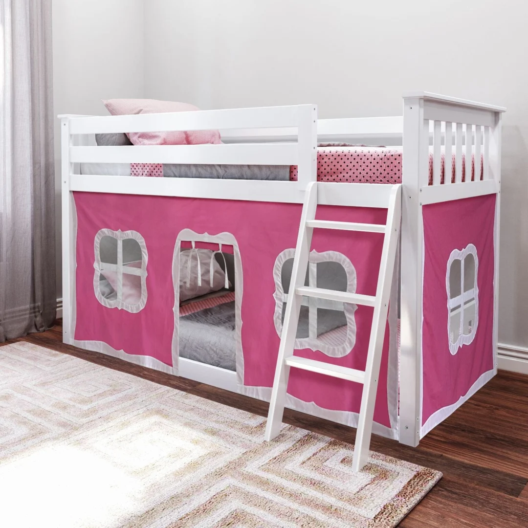 Max and Lily Twin Over Twin Low Bunk Bed With Curtain in Pink/White - low bunk bed with safety guardrails, angled ladder and pink playhouse curtain in a kids bedroom