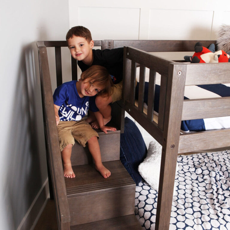 Max And Lily Twin Over Twin Low Bunk Bed With Staircase Curtain Clay Blue White Kids Playing Max and Lily Twin Over Twin Low Bunk Bed With Staircase & Curtain in Clay Blue/White - two children sitting on the staircase steps beside the bed
