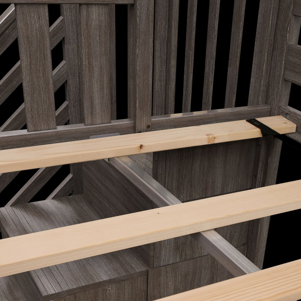 Max and Lily Twin Over Twin Low Bunk Bed With Staircase & Curtain in Clay Pink/White - close-up of the wooden slat support system and frame construction beneath the mattress.