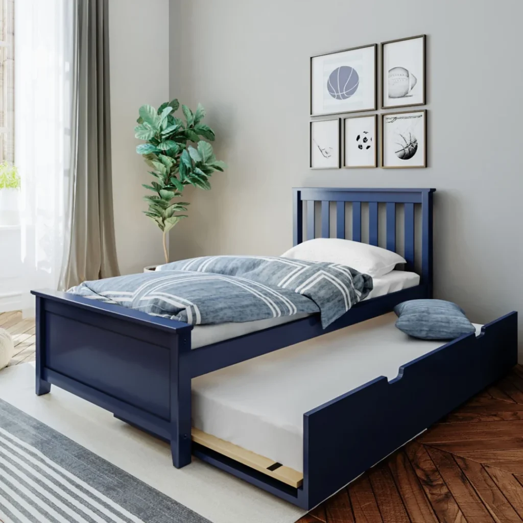 Max and Lily Twin Platform Bed With Trundle in Blue - styled in a kids bedroom with the trundle pulled out, slat headboard and sports-themed wall art
