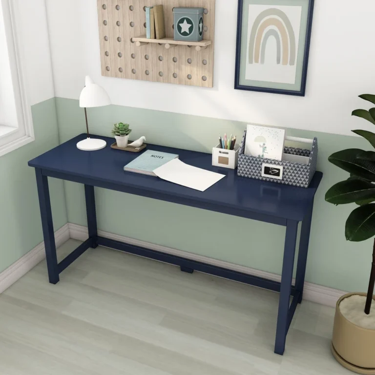 Max and Lily Writing Desk in Blue - styled in a kids' room with a desk lamp, potted plant and a pegboard wall organizer above.
