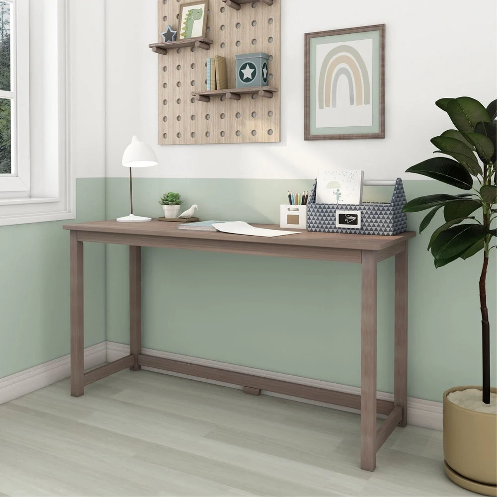 Max and Lily Writing Desk in Clay - angled view in a styled kids room with pegboard shelf and desk lamp.
