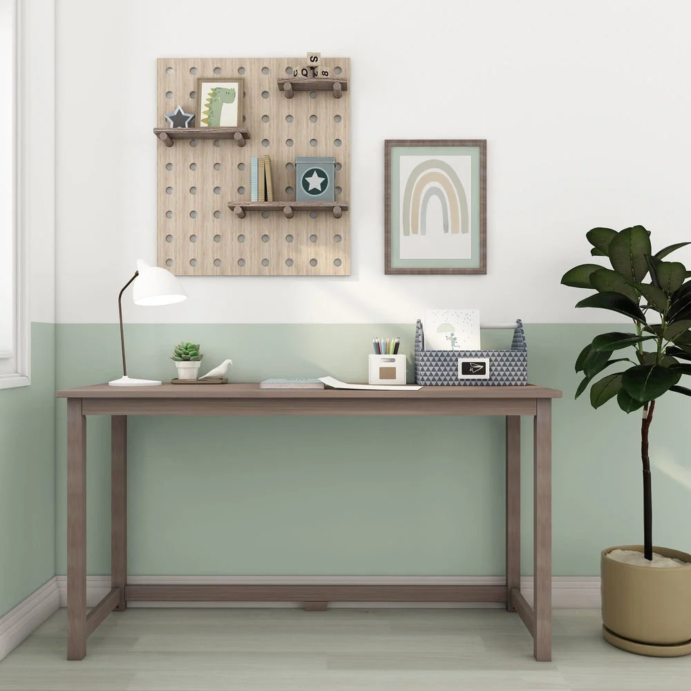Max and Lily Writing Desk in Clay - front view in a decorated kids room with pegboard shelving and framed wall art.