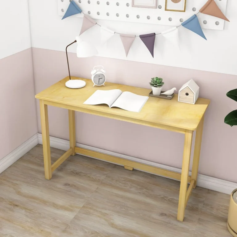 Max and Lily Writing Desk in Natural - styled in a pastel kids room with a desk lamp, alarm clock, and pegboard wall decor