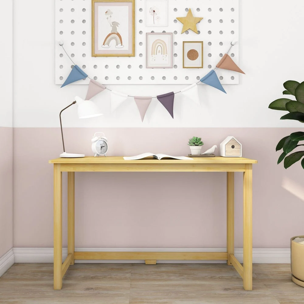 Max and Lily Writing Desk in Natural - front view in a kids room with pegboard artwork and bunting flags