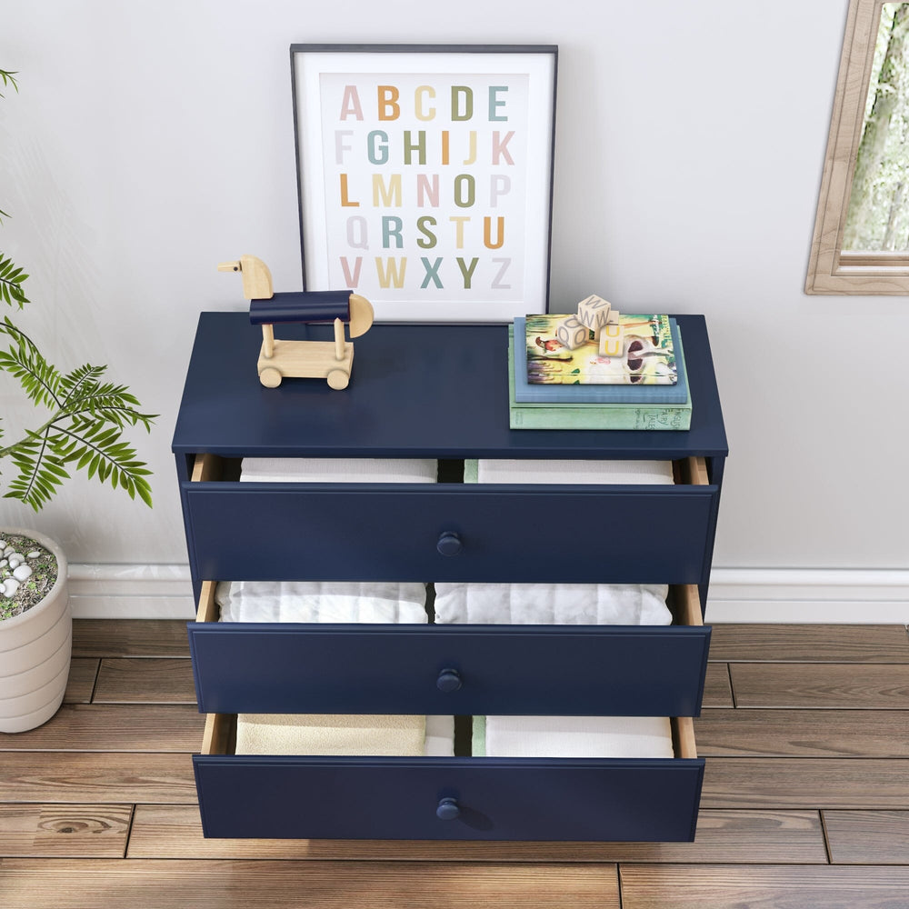 Max & Lily Classic 3 Drawer Dresser in Blue - top angle view with all three drawers pulled open to show folded linens and storage space.