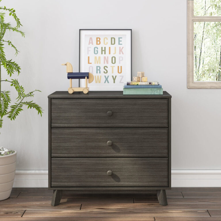Max Lily Classic 3 Drawer Dresser Clay Room Scene 2 Max & Lily Classic 3 Drawer Dresser in Clay - front-facing in a bright room beside a plant and window, with an alphabet print and toys on top.
