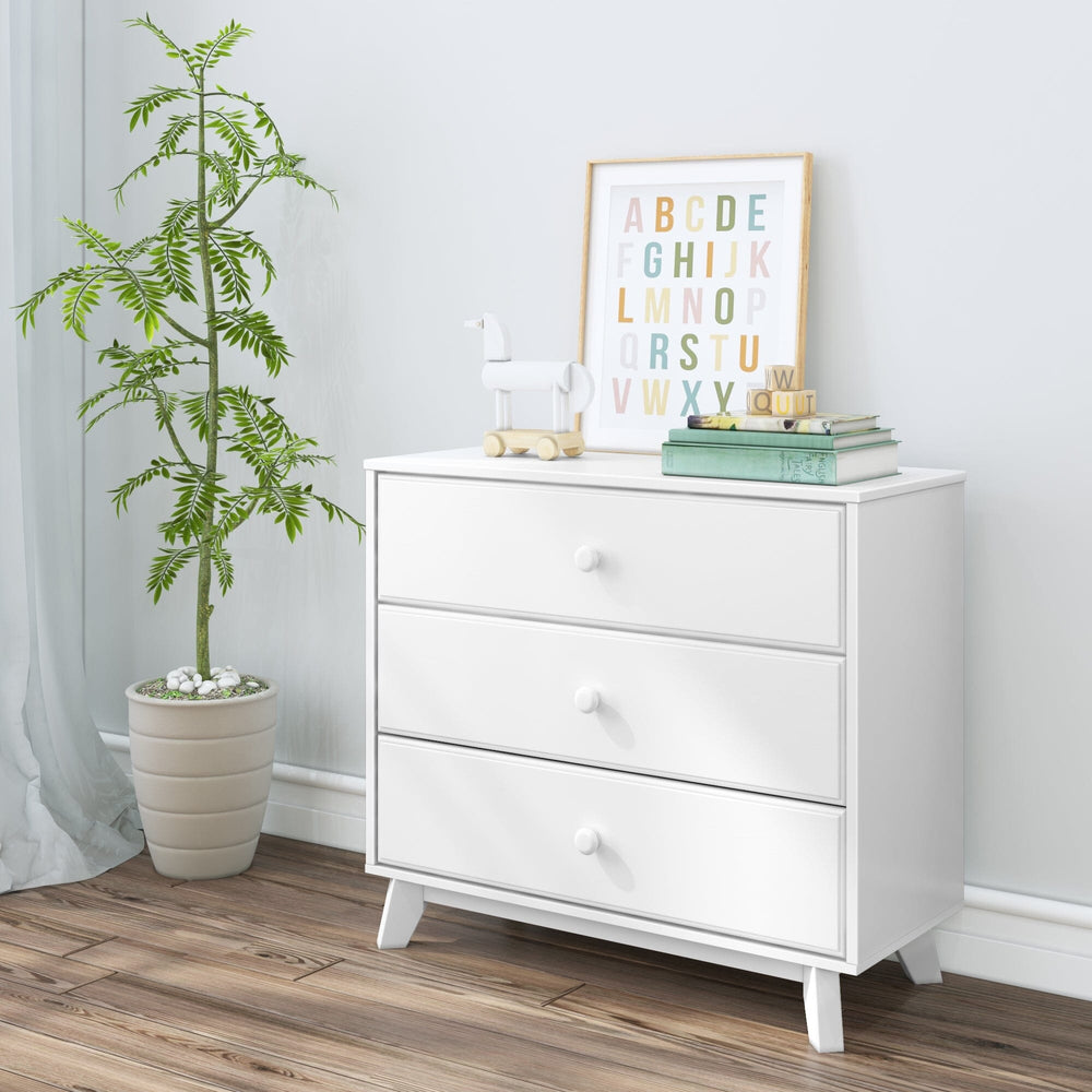 Max & Lily Classic 3 Drawer Dresser in White - angled room scene styled with a potted plant, alphabet print, and toy horse.