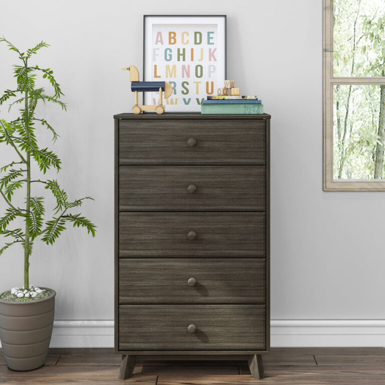 Max Lily Classic 5 Drawer Dresser Clay Room Scene 2 Max & Lily Classic 5 Drawer Dresser in Clay - front view in a bedroom setting beside a potted plant and window with a framed alphabet print and books on top