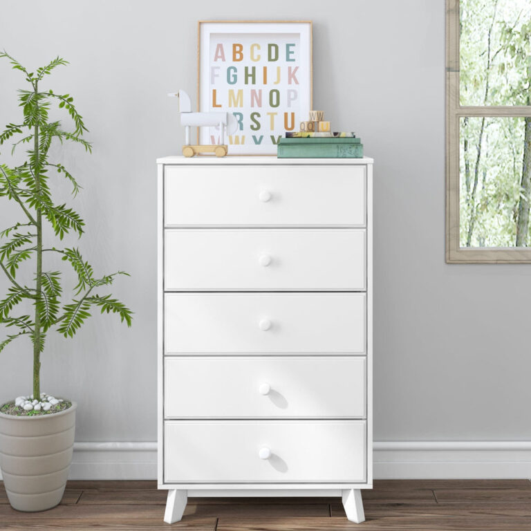 Max Lily Classic 5 Drawer Dresser White Room Scene Max & Lily Classic 5 Drawer Dresser in White - styled in a child's room with a potted plant, framed alphabet print, and wooden toys on top.