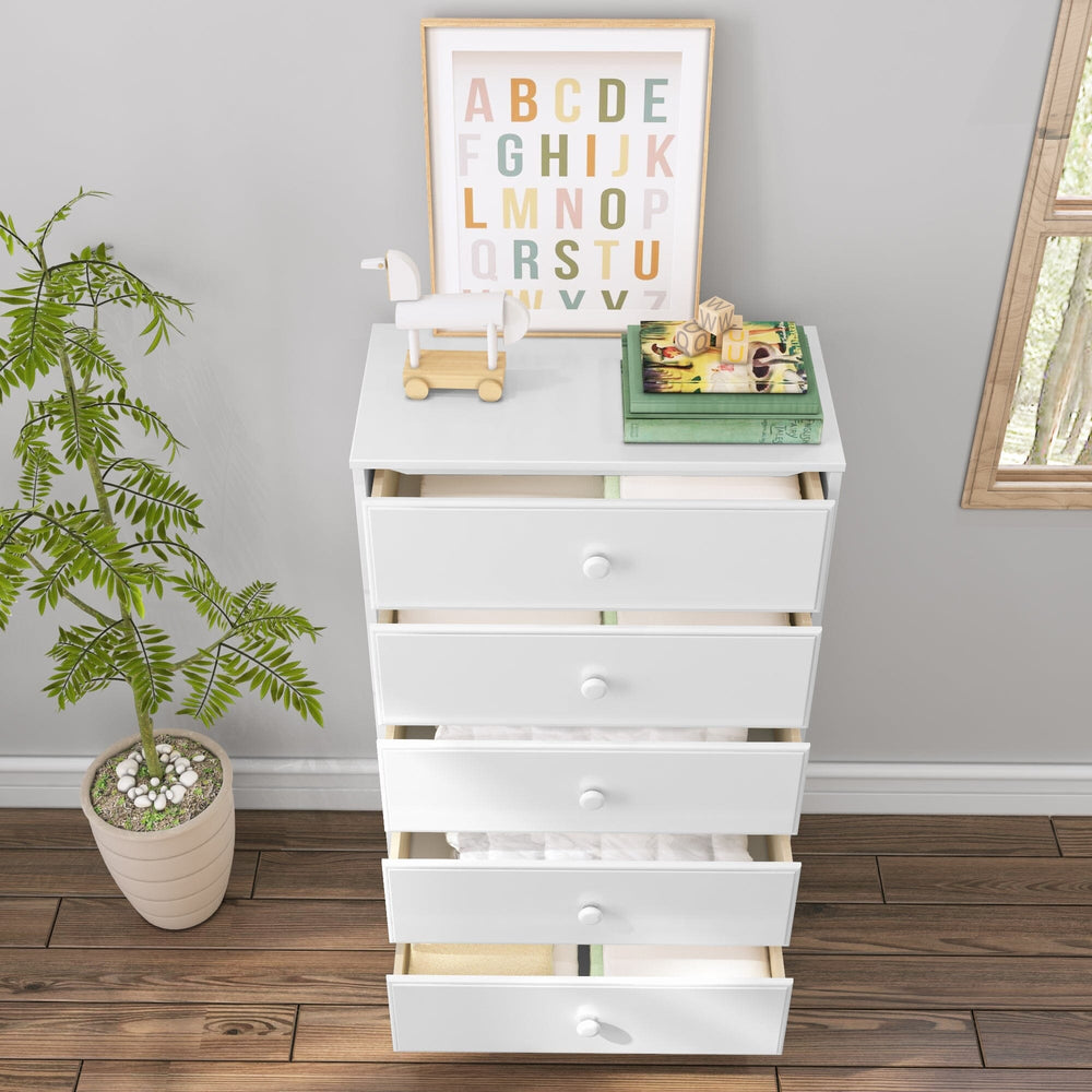 Max & Lily Classic 5 Drawer Dresser in White - all five drawers open in a child's room showing storage space, with a plant and framed alphabet print nearby.