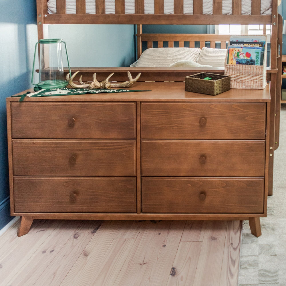 Max Lily Classic 6 Drawer Dresser Pecan Room Scene 1 Max & Lily Classic 6 Drawer Dresser in Pecan - styled in a child's bedroom beneath a bunk bed with a lantern, antlers, and a basket of books on top.