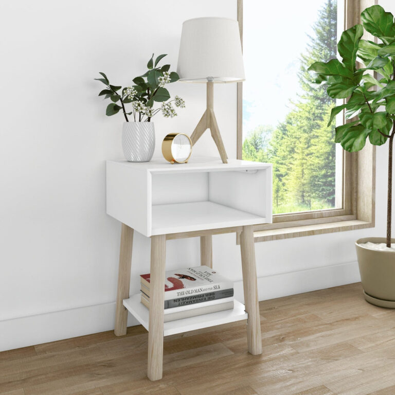 Max Lily Mid Century Modern Cubby Night Stand White Blonde Room Scene 1 Max & Lily Mid-Century Modern Cubby Night Stand in White/Blonde - styled beside a window with a table lamp, plant, clock, and books on the open lower shelf.